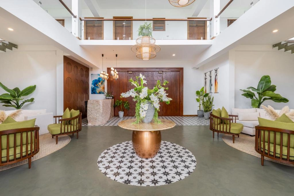 Wooden villa with pool and lounge chairs